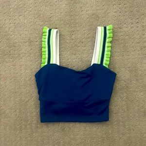 this tank top is a dance top from free people and has a cross on the back